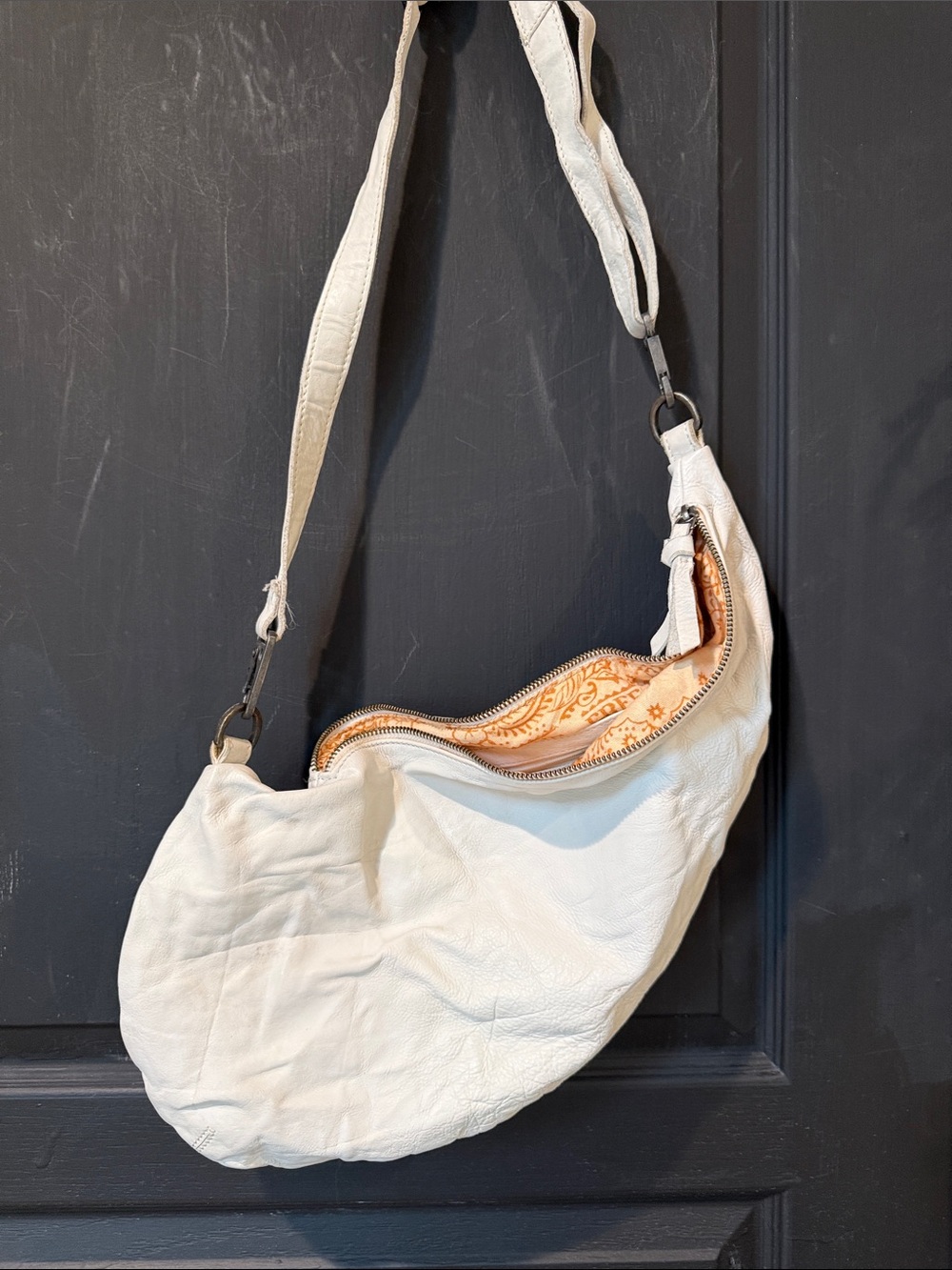 We The Free Cream Leather Crescent Shoulder Bag with Peach Lining washed leather